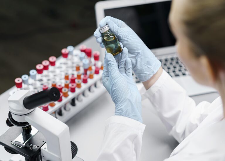 female-researcher-laboratory-with-test-tubes-vaccine-bottle